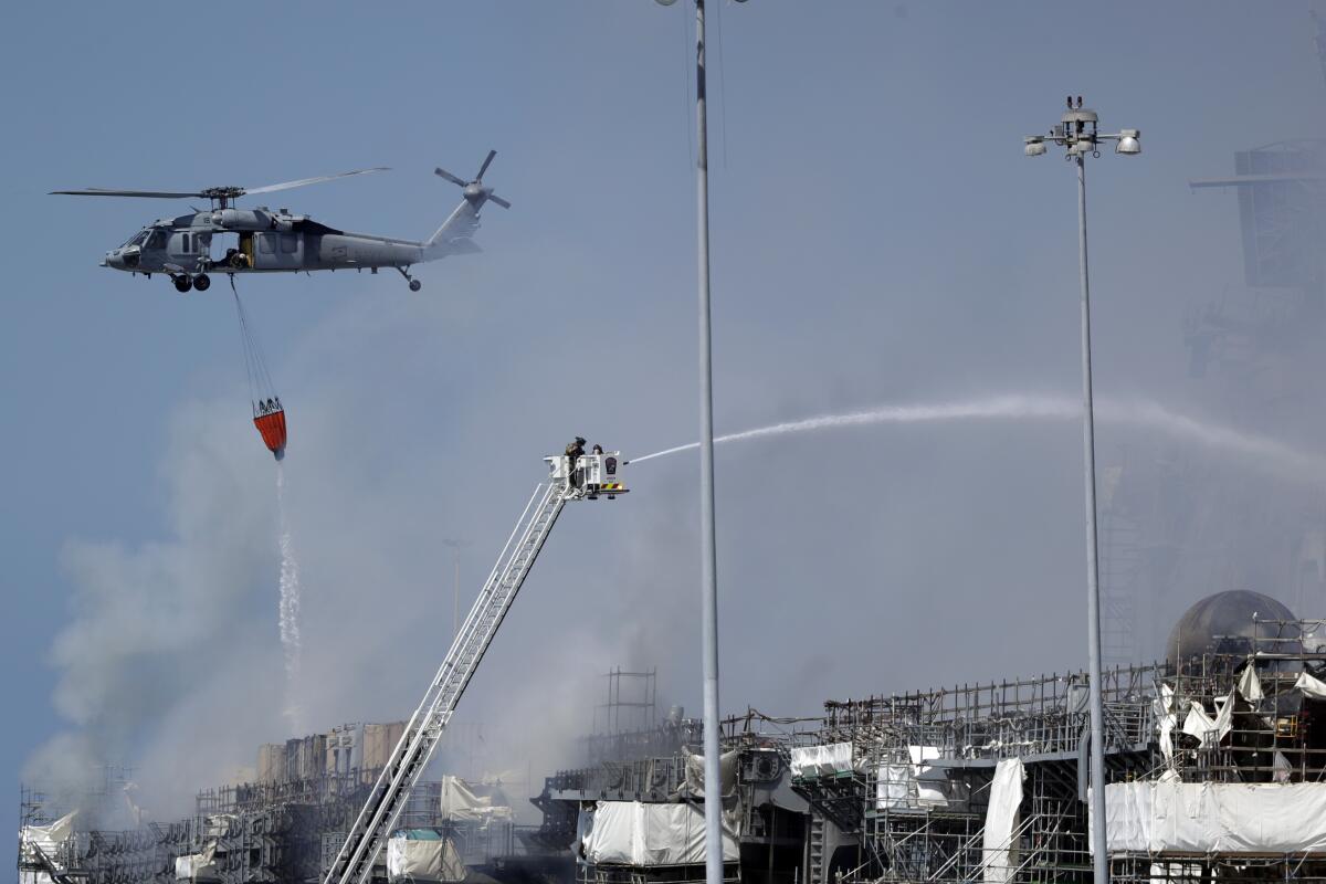 Fire crews battle the fire on the USS Bonhomme Richard on July 13