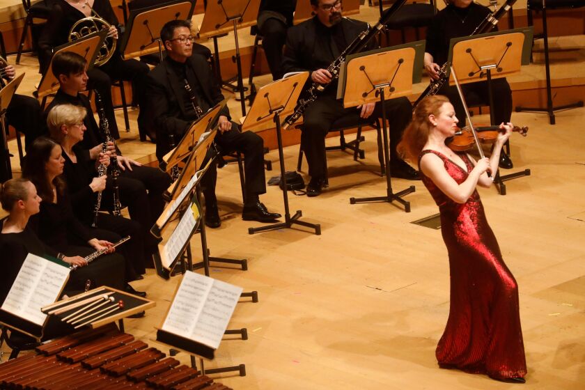 LOS ANGELES CA - FEBRUARY 7, 2020 - Violinist Carolin Widmann performs as Esa-Pekka Salonen, off camera, conducts the LA Phil in Weill’s Violin Concerto as part of a program titled, “The Weimar Republic: Germany 1918-1933,” at the Walt Disney Concert Hall on February 7, 2020. (Genaro Molina / Los Angeles Times)