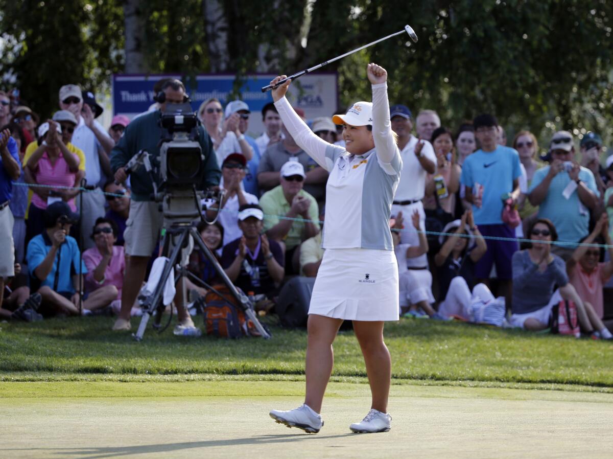 Inbee Park celebrates Sunday after winning the KPMG Women's PGA Championship for a third consecutive year.