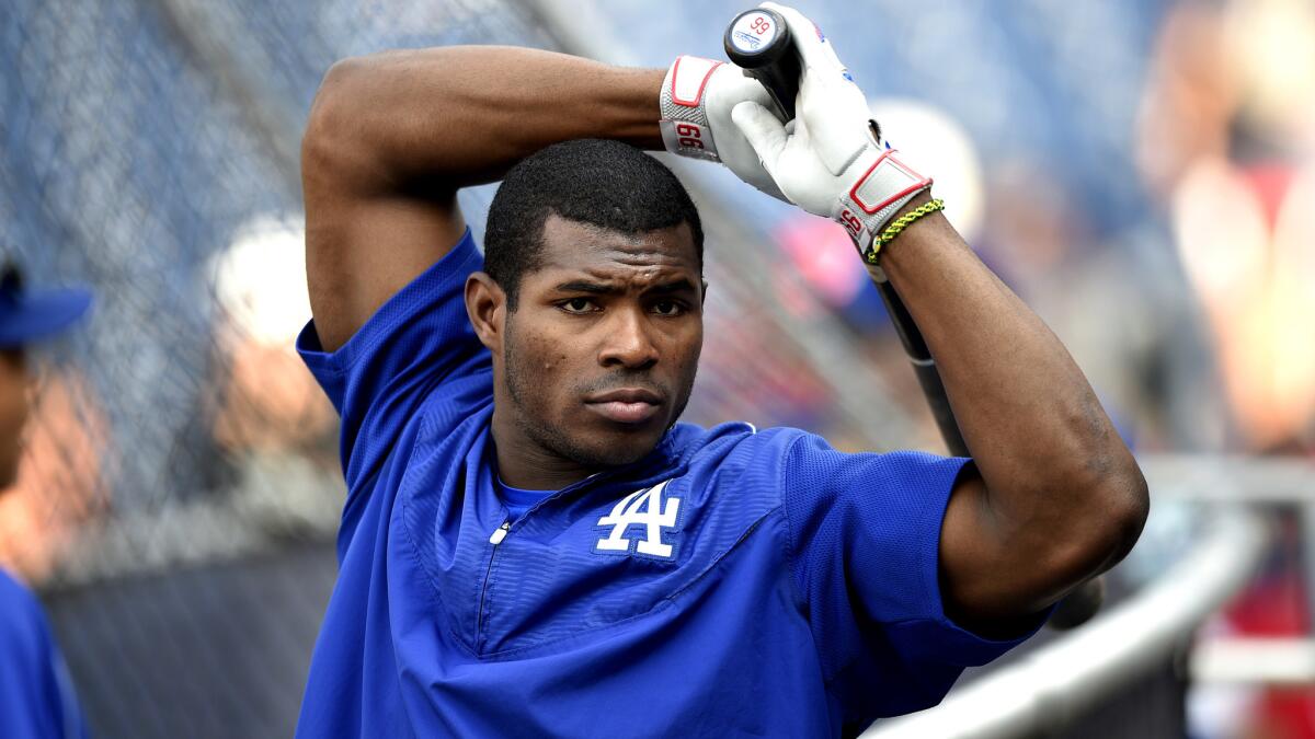 Yasiel Puig stretches before taking batting practice with the Dodgers on July 21.