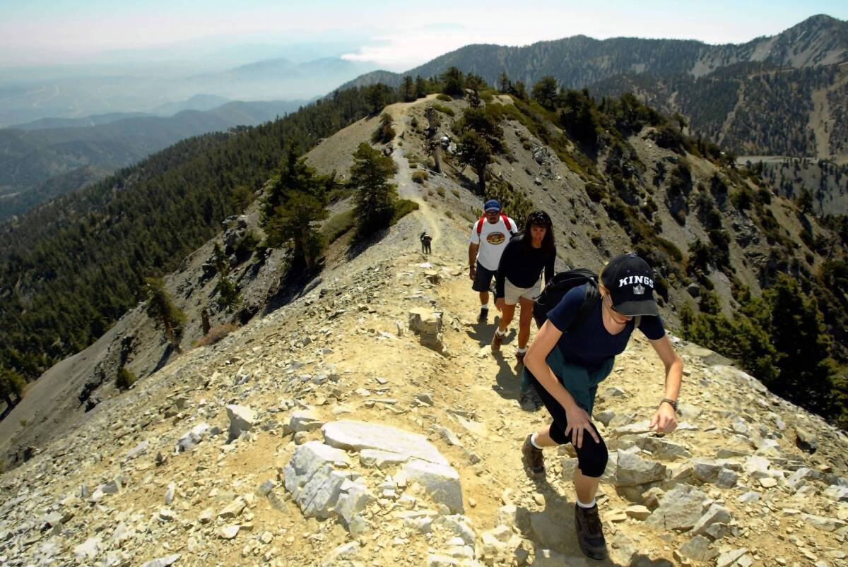 Hikers ascend to the top of Mt. Baldy. Routes to the summit are closed through April 30.