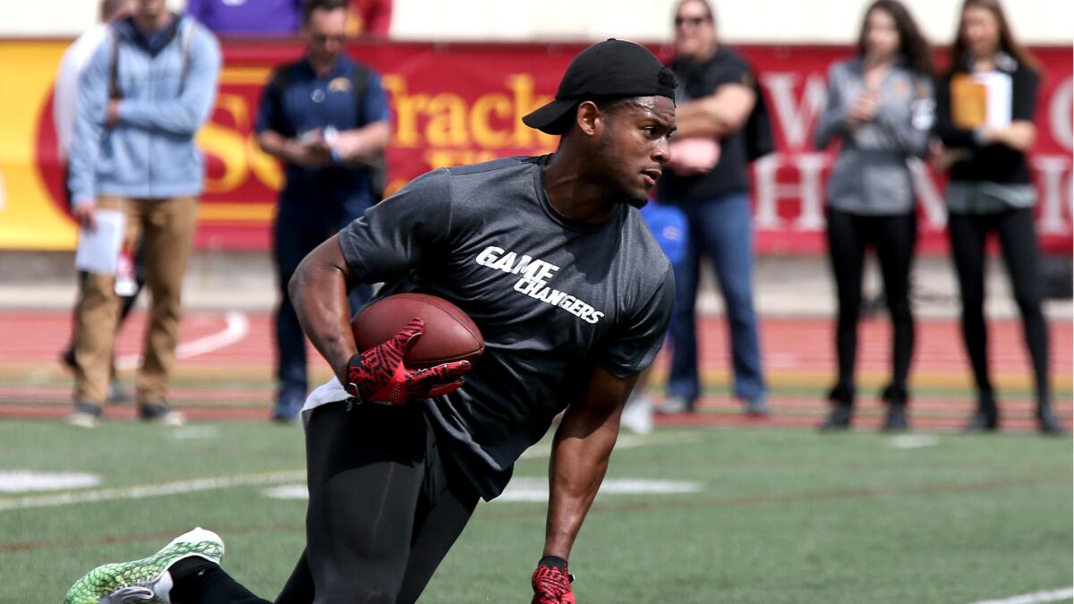 Wide receiver JuJu Smith-Schuster runs a drill during USC's pro day on Wednesday.