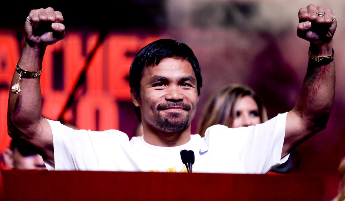 Boxer Manny Pacquiao greets fans at a rally in Las Vegas on Tuesday.