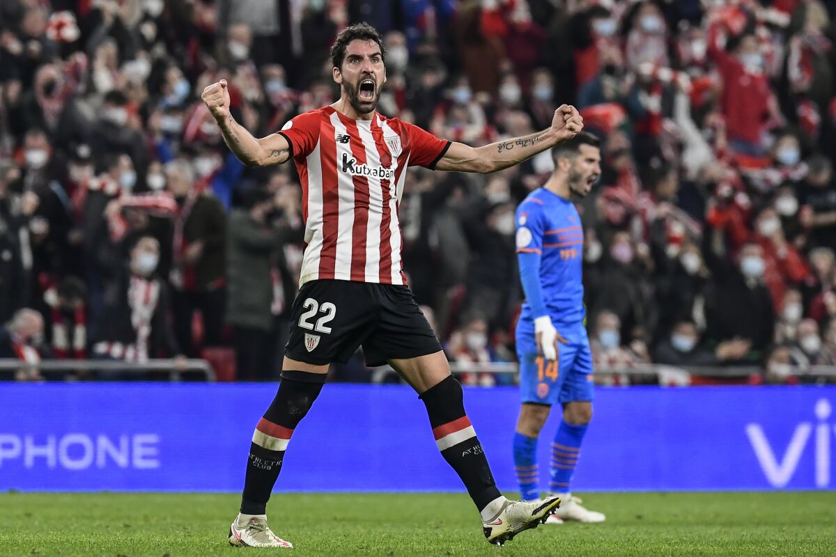 Athletic Bilbao's Raul Garcia celebrates after scoring his side's first goal during a Spanish Copa del Rey semifinal first leg soccer match between Athletic Club and Valencia at the San Mames stadium in Bilbao, Spain, Thursday, Feb. 10, 2022. (AP Photo/Alvaro Barrientos)