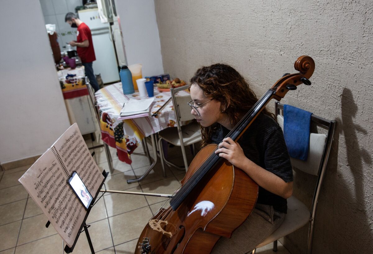  Sarah Sampaio Morente, a 16-year-old student of the Baccarelli Institute, attends an online class in her house