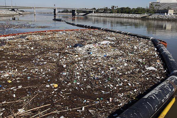 A trash boom keeps a massive refuse heap from flowing out of the Los Angeles River and into the Pacific Ocean. Storms often leave Southern California beaches littered with the region's trash. Full story