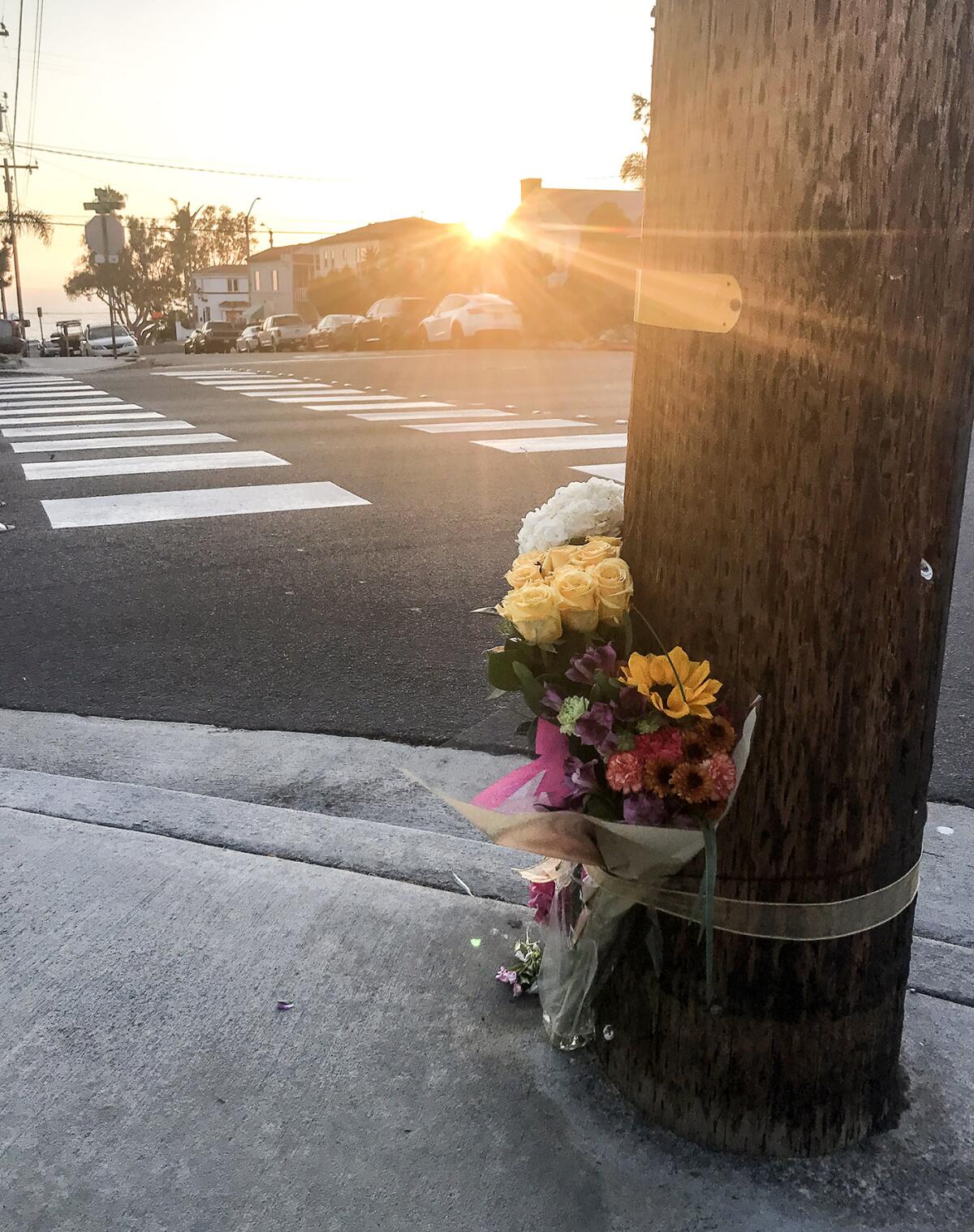 Flowers were left at the corner of Oak Street and Glenneyre Street.