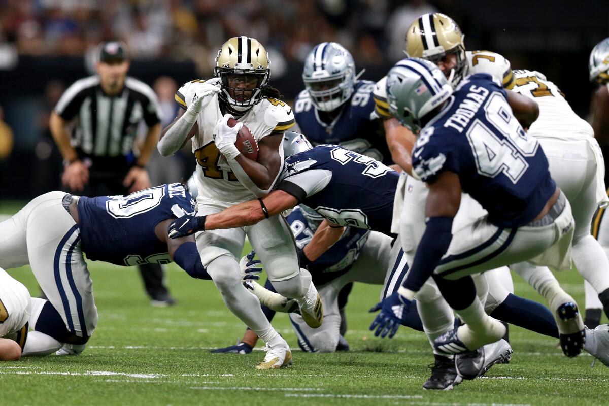 Saints running back Alvin Kamara carries the ball against the Dallas Cowboys on Sunday.