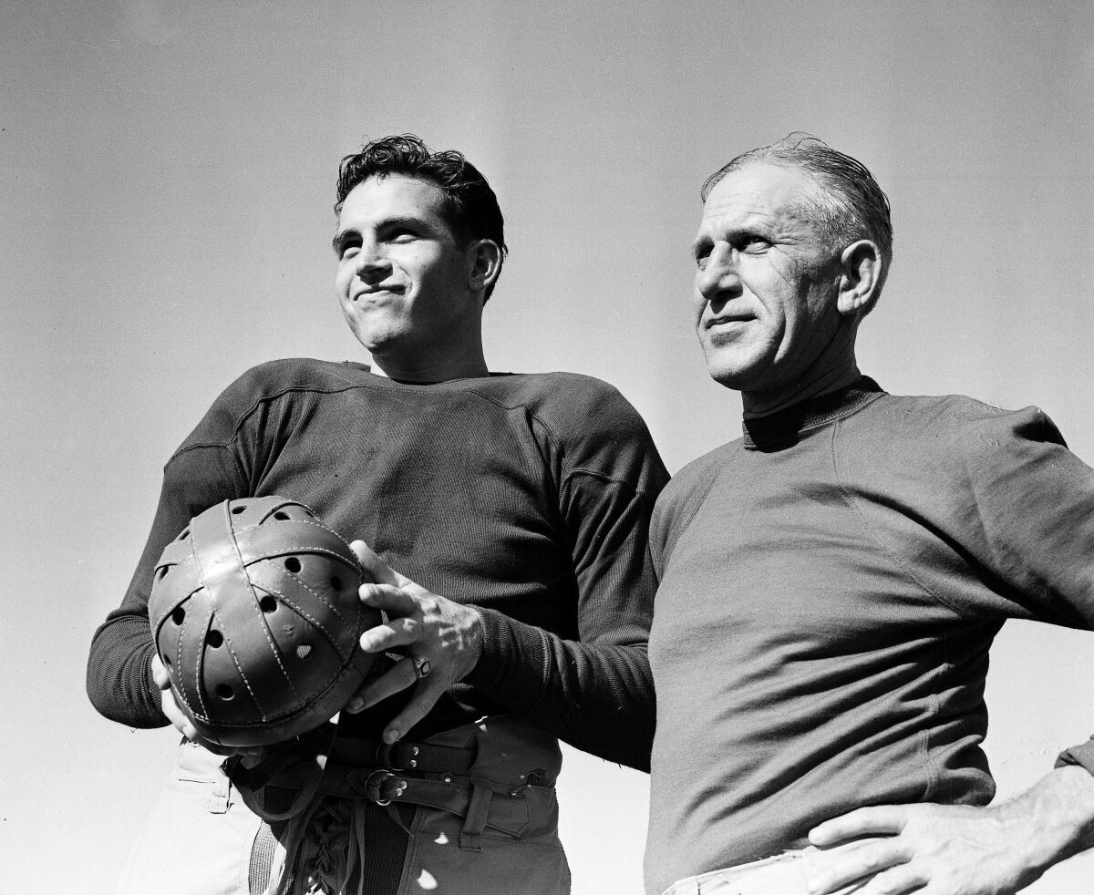 USC football captain Don McNeil, who plays center, with coach Howard Jones.