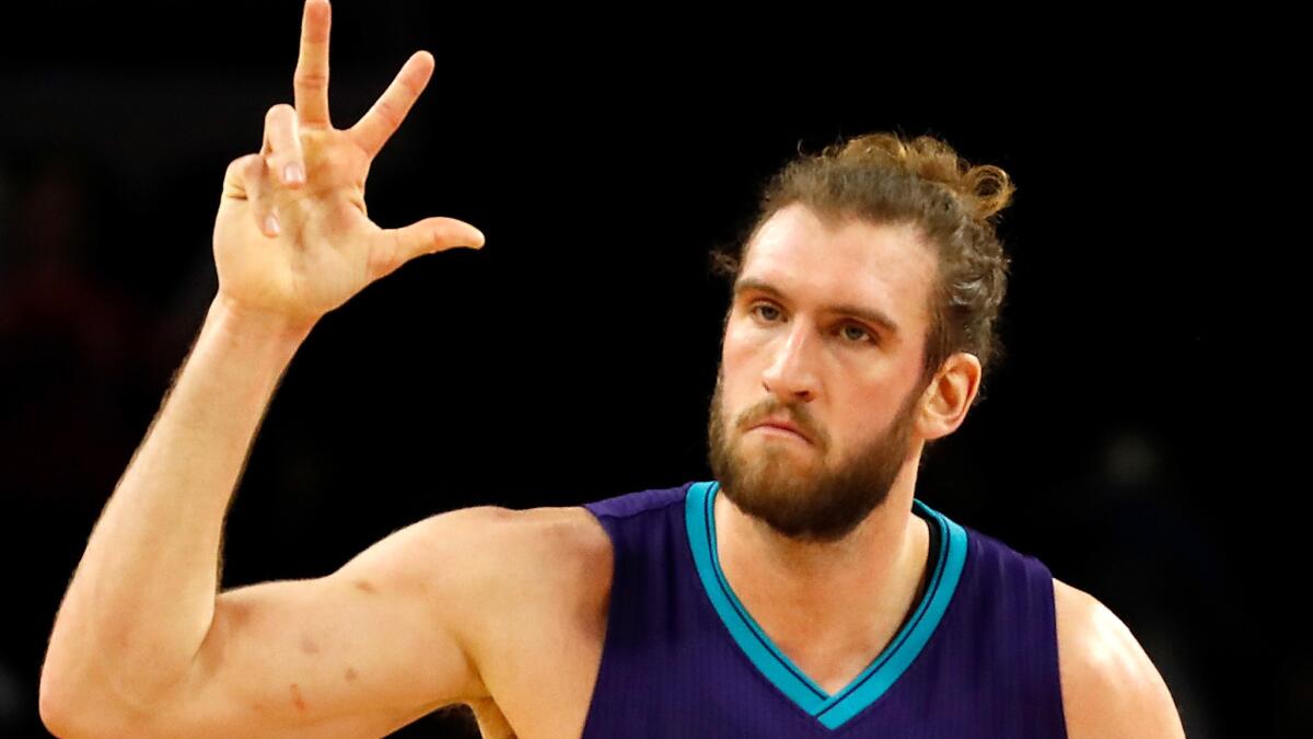 Spencer Hawes celebrates after making a three-point shot for the Hornets during a game against the Pistons on Jan. 5.