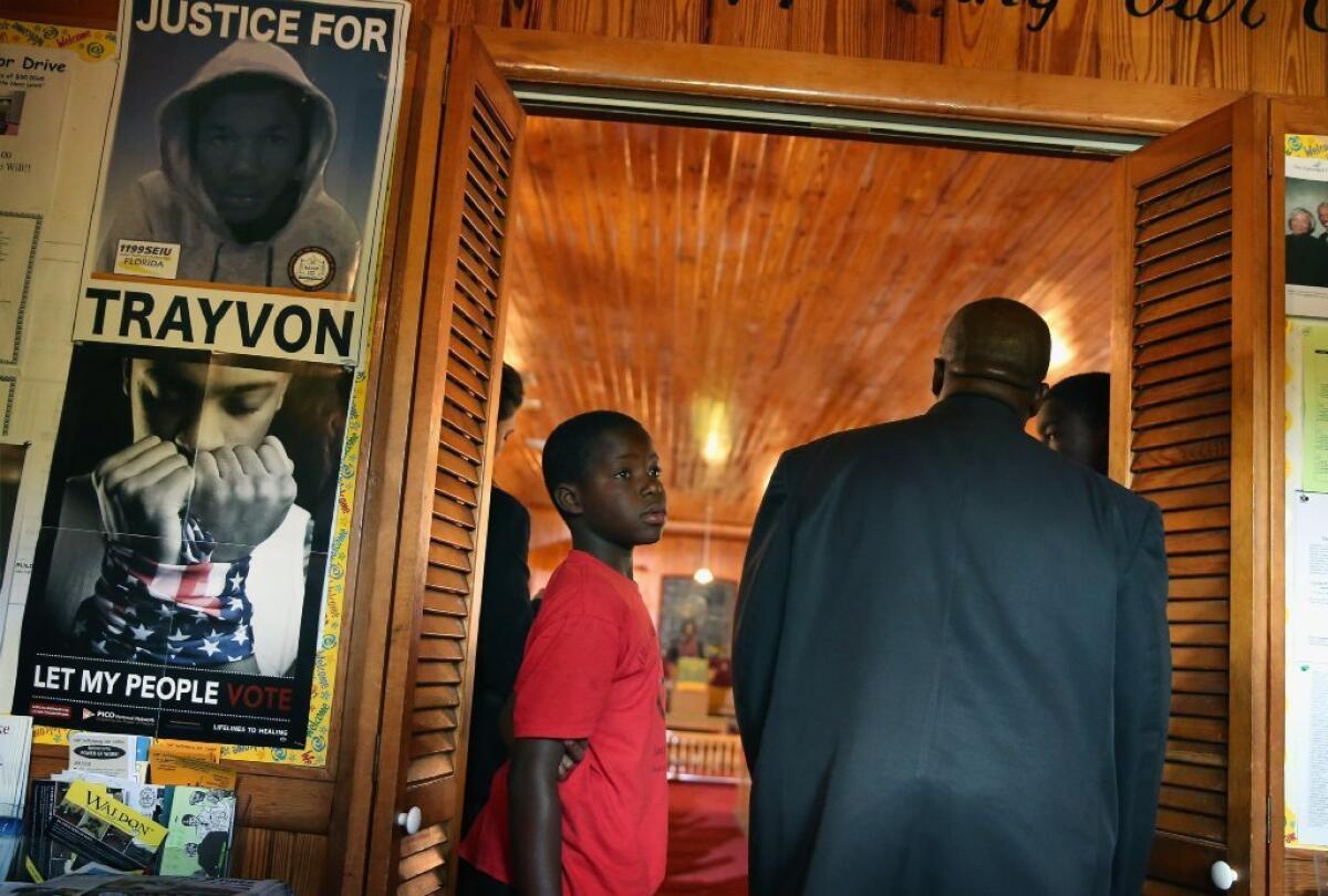 Parishioners arrive for Sunday service at Allen Chapel AME church in the historic black neighborhood of Goldsboro in Sanford, Fla. During the service Pastor Valarie Houston compared 17-year-old Trayvon Martin, who was shot and killed in February 2012 by neighborhood watch volunteer George Zimmerman, to civil rights icons Medgar Evans and Emmitt Till.