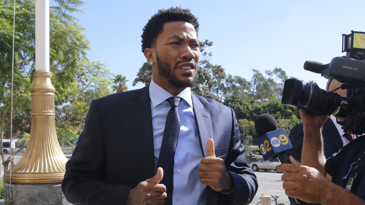 New York Knicks basketball player Derrick Rose arrives at U.S. District Court in downtown Los Angeles during the civil trial in which a former girlfriend accused him and two friends of raping her.