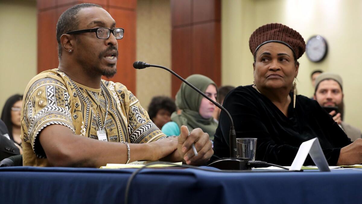 Muhammad Ali Jr., left, son of the late boxing legend, and his mother, Khalilah Camacho Ali, participate in a forum about immigration enforcement at the Capitol in Washington.