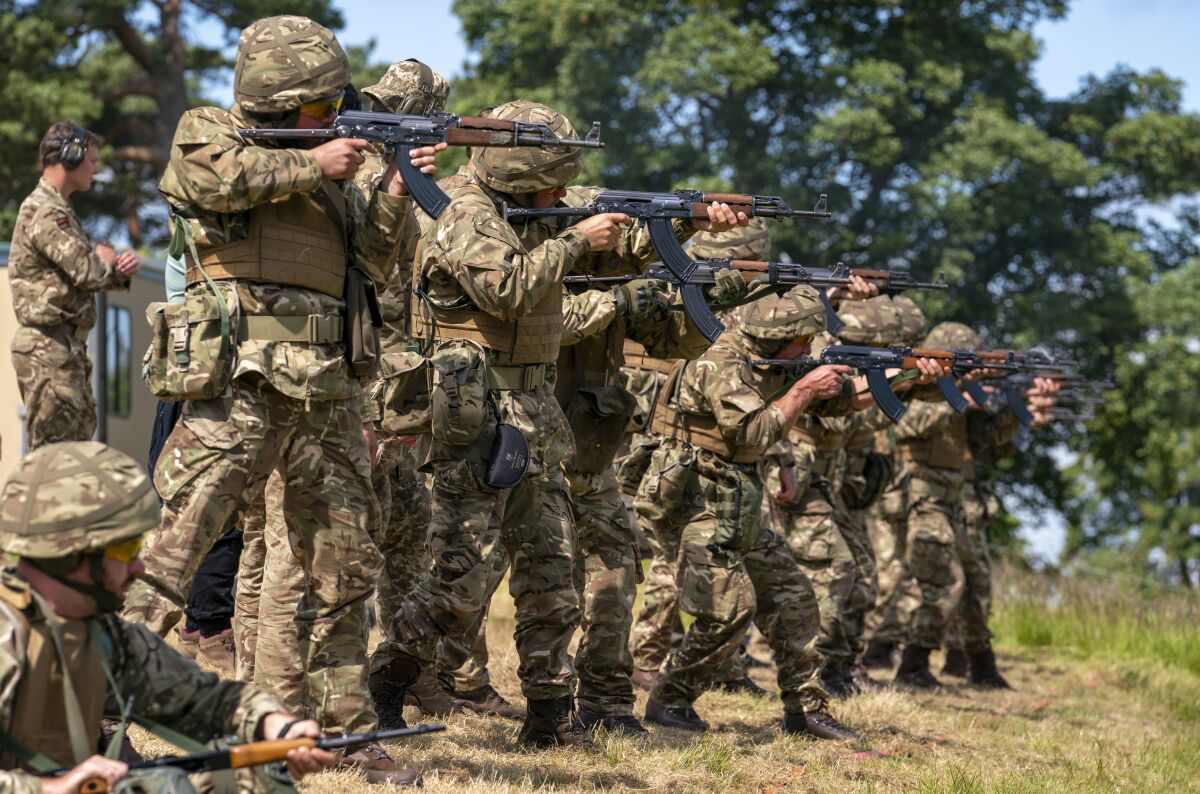 New recruits to the Ukrainian army are trained by UK army specialists at a military base near Manchester, England, Thursday, July 7, 2022. (Louis Wood/Pool Photo via AP)