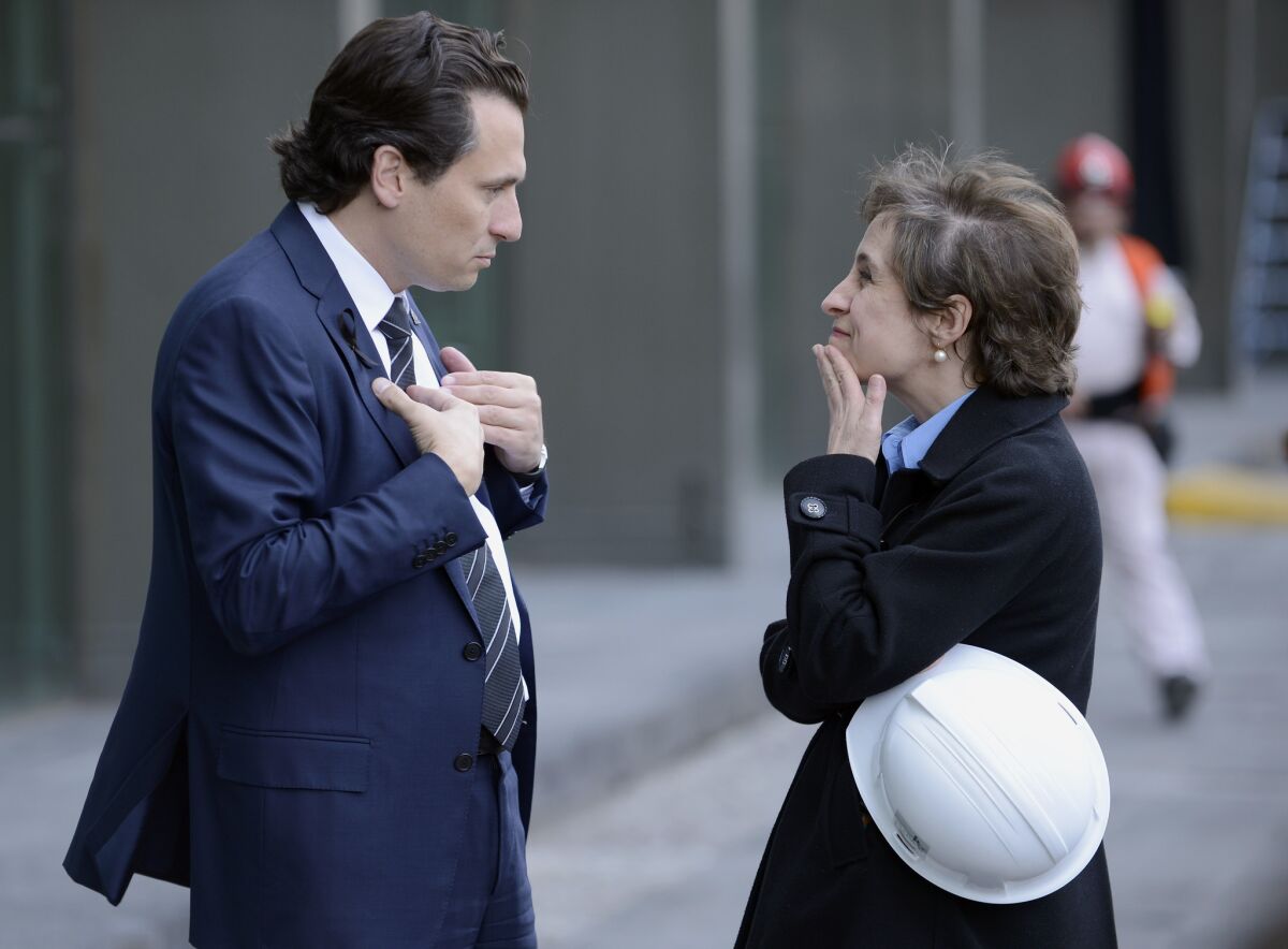 Mexican journalist Carmen Aristegui, shown talking with Pemez Chief Executive in February 2013, has been fired by her radio station.