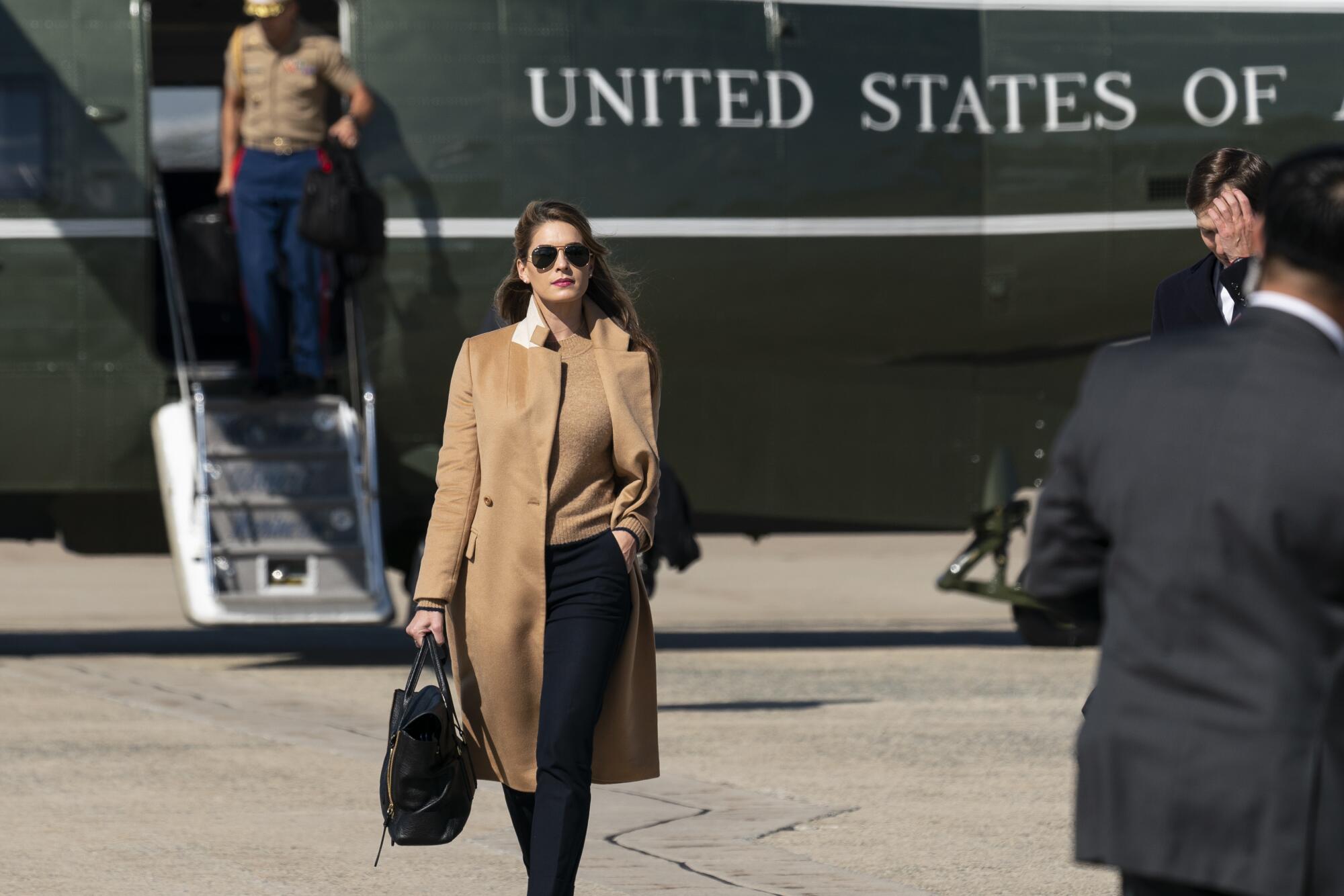 Aide to the president Hope Hicks walks from Marine One on Wednesday