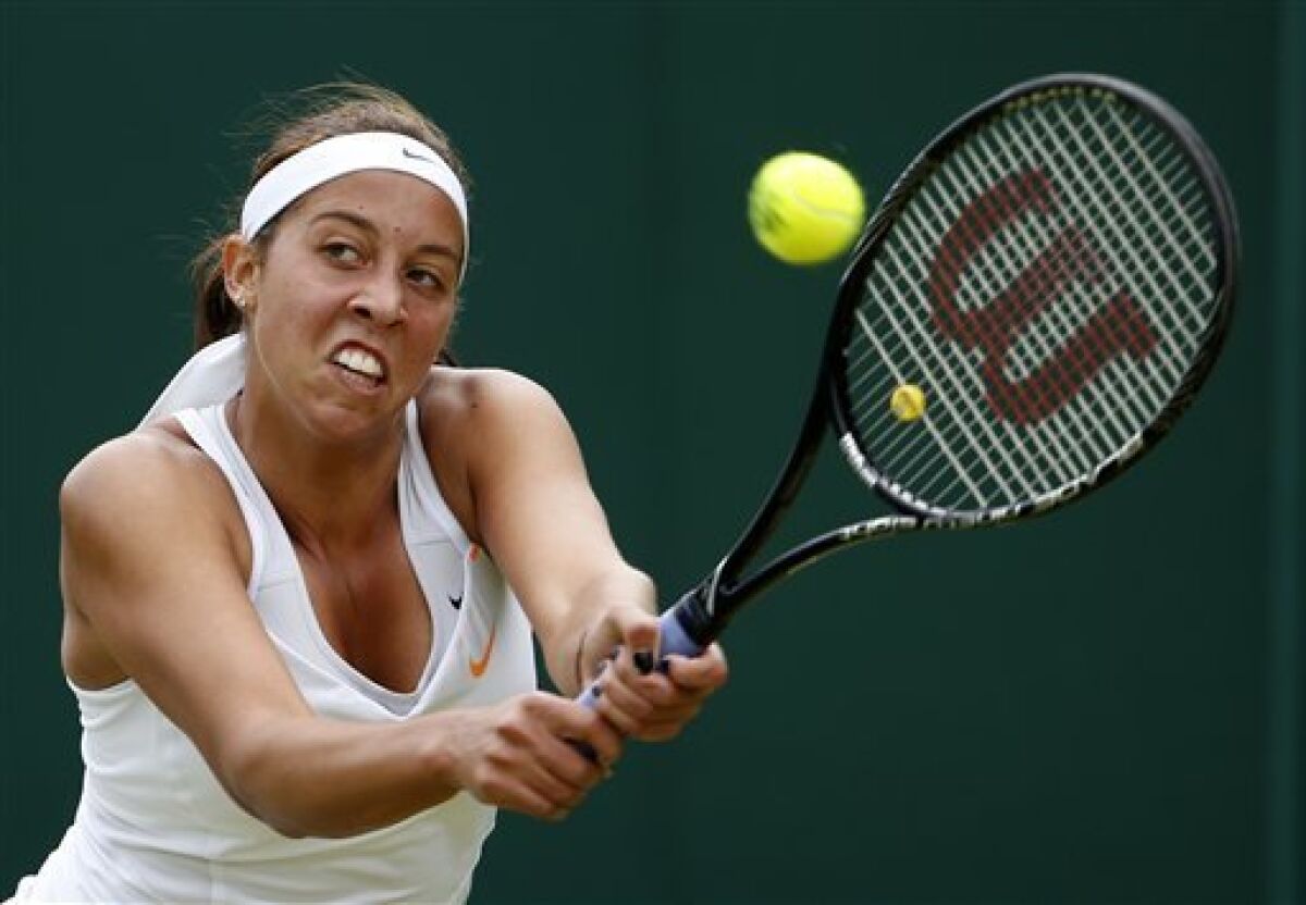 Madison Keys of the United States returns to Mona Barthel of Germany during their Women's second round singles match at the All England Lawn Tennis Championships in Wimbledon, London, Thursday, June 27, 2013. (AP Photo/Sang Tan)