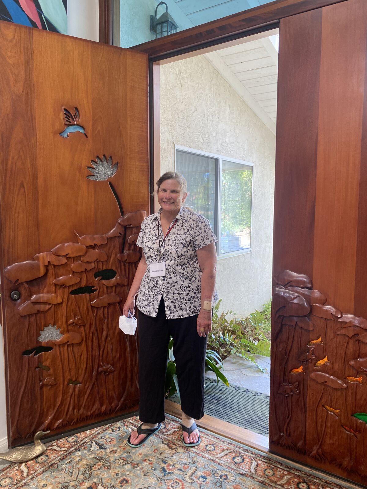 La Jolla artist Jane Fletcher shows her front doors, which she carved. 