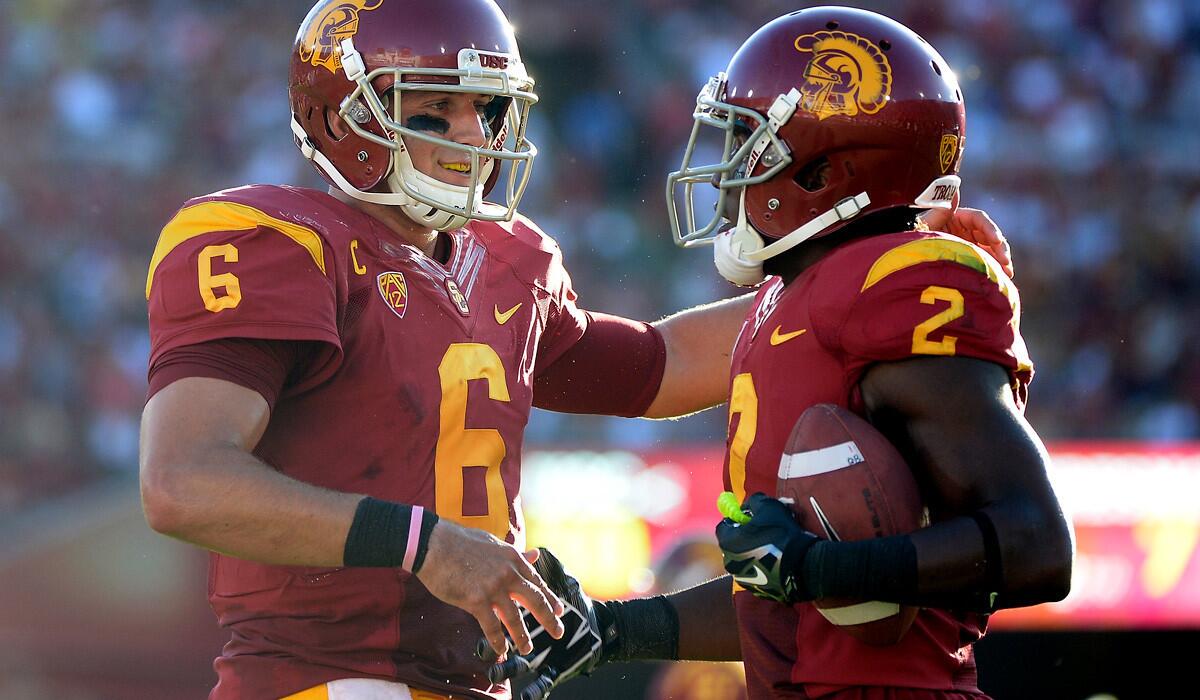 USC quarterback Cody Kessler (6) congratulates Adoree' Jackson after the two connected for a touchdown pass against Fresno State in the 2014 season opener.