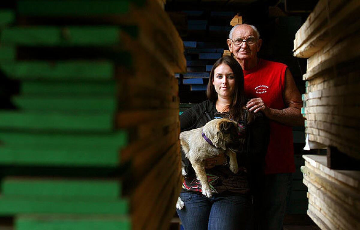 Charlie Bohnhoff and his granddaughter, Christa, at the longtime family-owned lumberyard in Vernon. The lumberyard was the site of shootings in May, when Alan Bohnhoff, Charlie's son and Christa's dad, was one of two killed. It's a tragedy from which the family and the business are slowly recovering, at least on the surface.