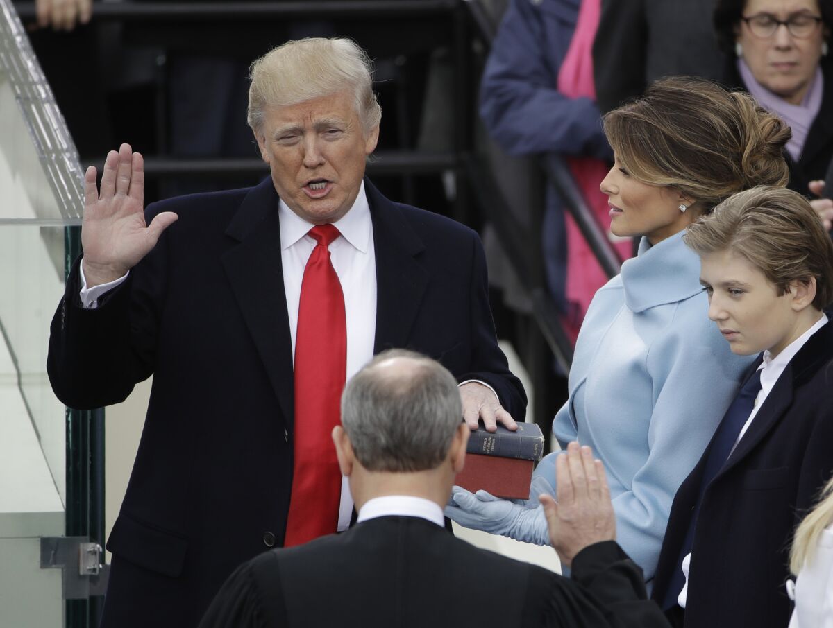 Donald Trump is sworn in as the 45th president of the United States by Chief Justice John G. Roberts Jr. (Matt Rourke / Associated Press)