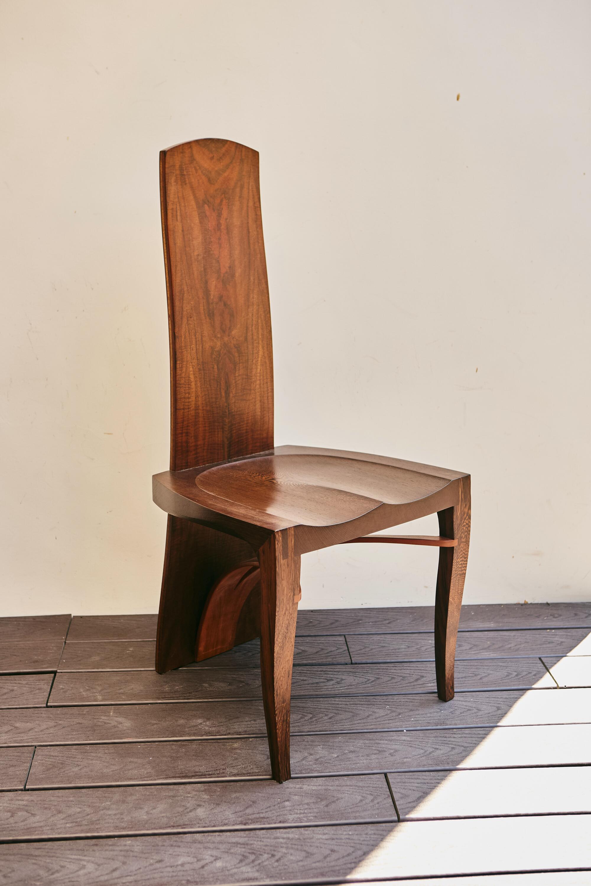 A chair on a wooden deck.