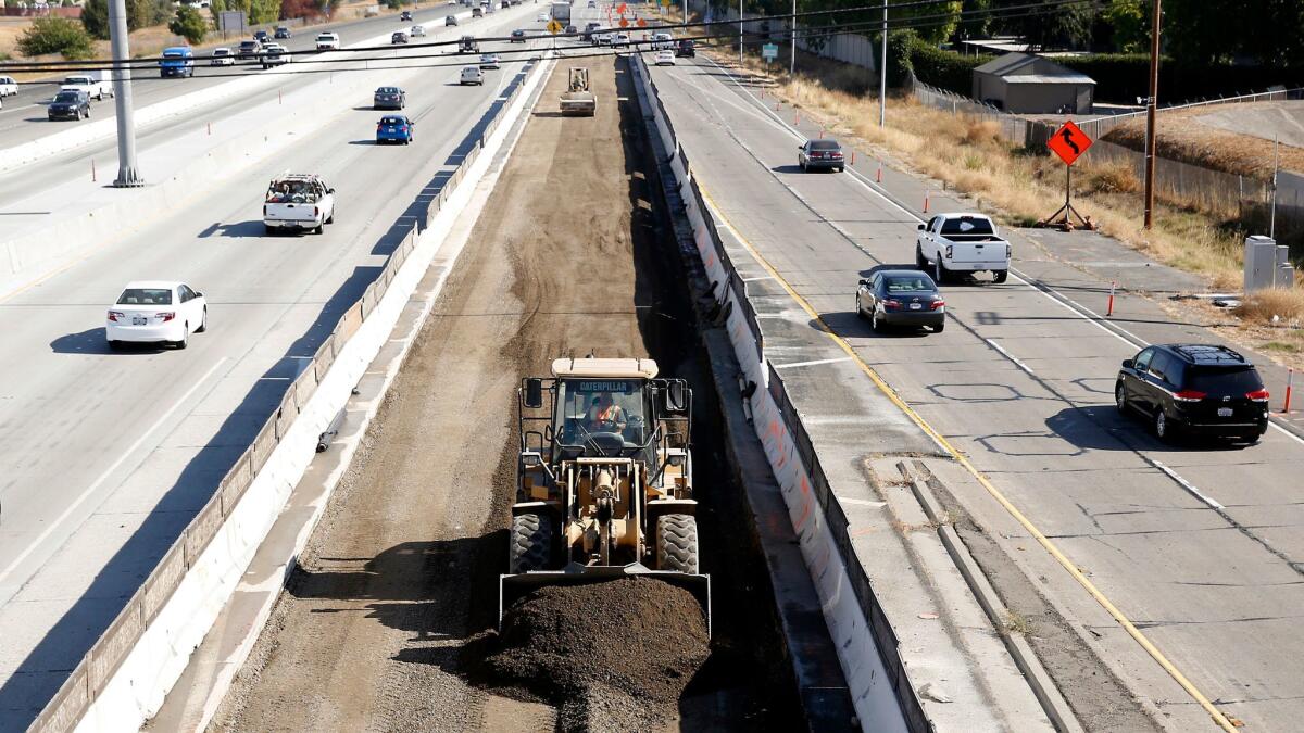 Vehicles pass a highway construction site on Interstate 80 in Sacramento in 2015.