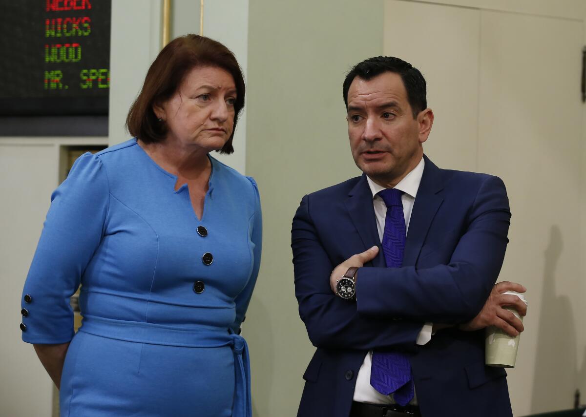 Senate President Pro Tem Toni Atkins talks with Assembly Speaker Anthony Rendon.