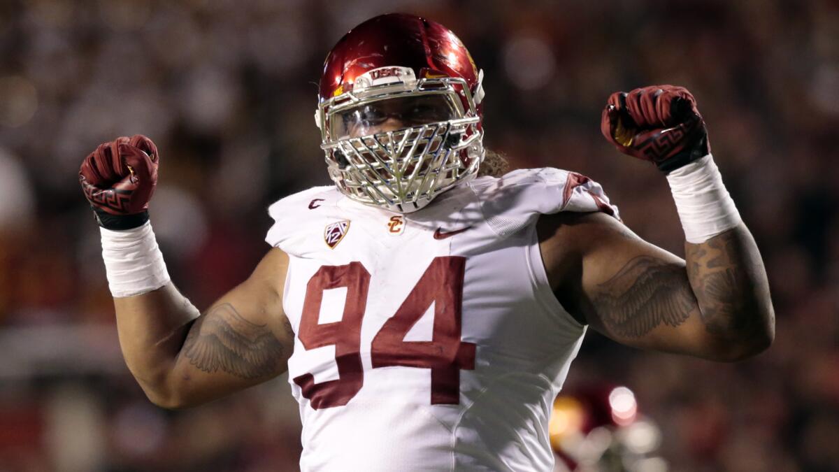 USC defensive lineman Leonard Williams celebrates after making a tackle against Utah on Oct. 25.