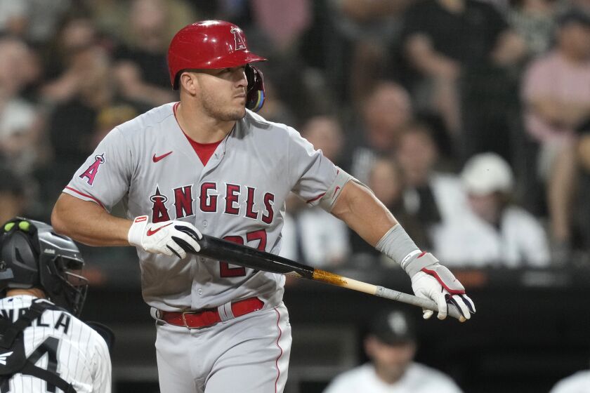 Los Angeles Angels' Mike Trout looks back at Chicago White Sox starting pitcher Lucas Giolito after Giolito struck Trout out during the fourth inning of a baseball game Tuesday, May 30, 2023, in Chicago. (AP Photo/Charles Rex Arbogast)