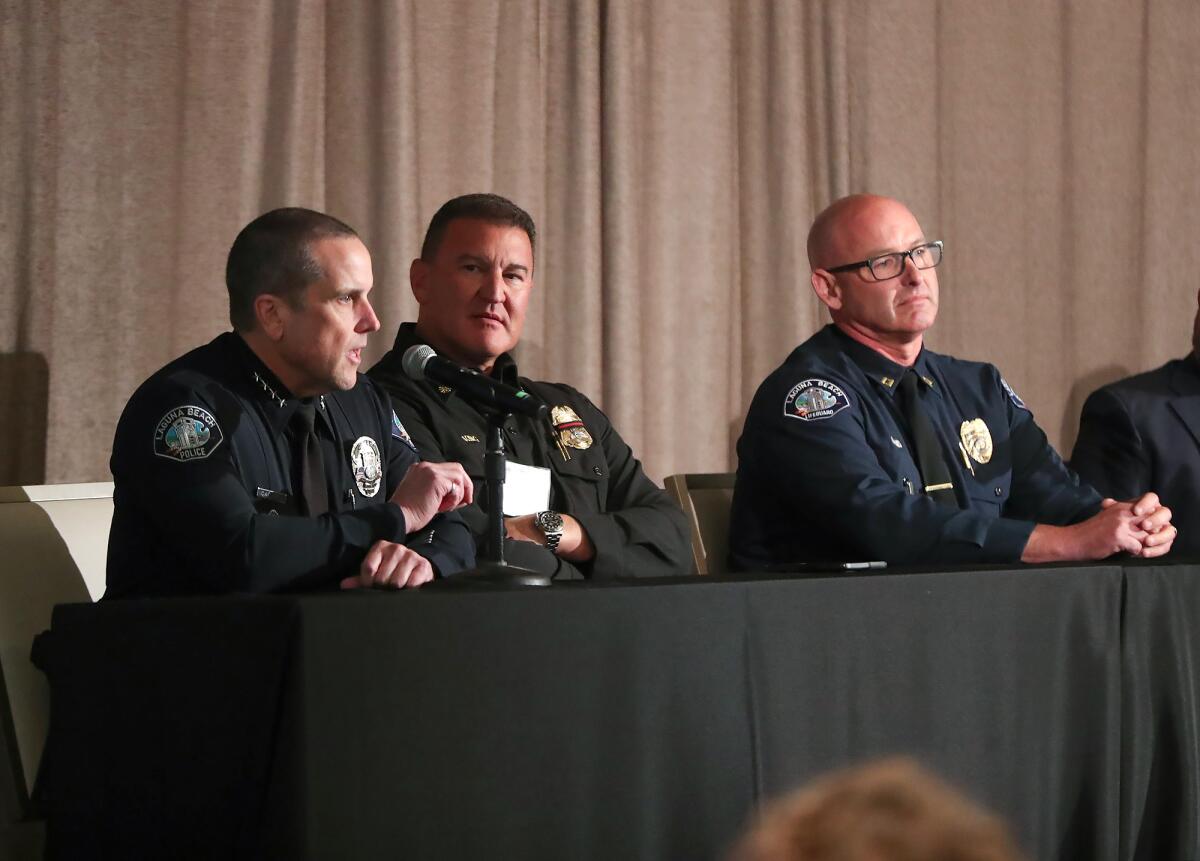 Police Chief Jeff Calvert, Fire Chief Niko King, and Marine Safety Captain Kai Bond, from left, sit on a panel on Tuesday.