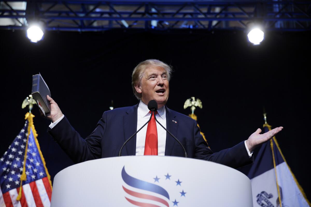 Speaking at the Iowa Faith and Freedom Coalition, leading Republican contender Donald Trump held his favorite book, the Bible. Trump will publish another of his own books in October.