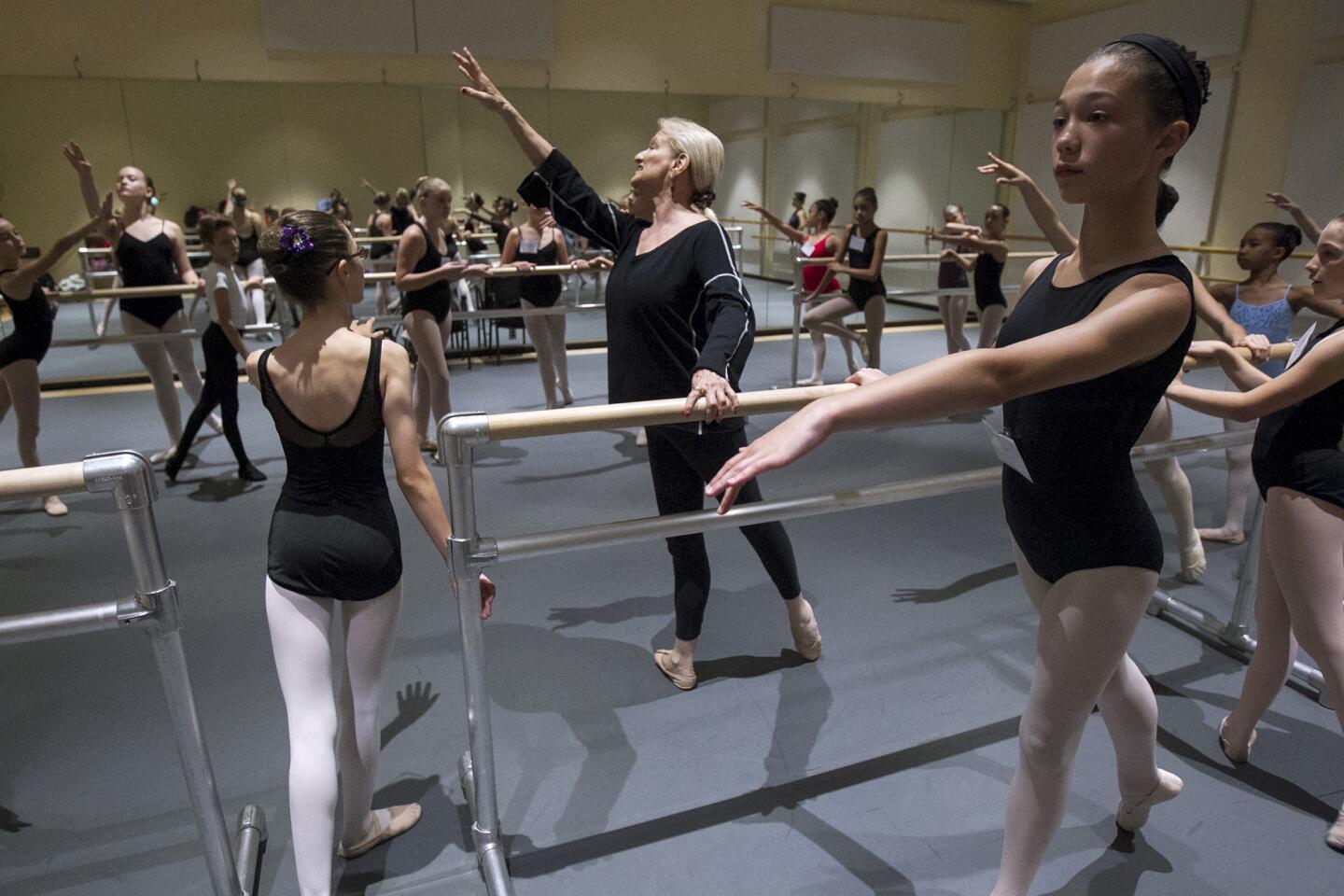 Alaine Haubert gives instructions to students during the Young Dancer Summer Workshops on Thursday, July 9. Haubert is the principal of the American Ballet Theatre William J. Gillespie School at Segerstrom Center for the Arts which will open the dance school officially in September.