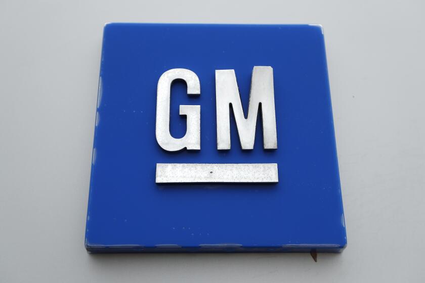 FILE - The General Motors logo is seen, Jan. 27, 2020, in Hamtramck, Mich. On Tuesday, Oct. 17, 2023, General Motors announced that it will delay electric pickup truck production at a factory near Detroit due to slowing U.S. demand for electric vehicles, to better manage its capital investments, and to make some engineering changes. (AP Photo/Paul Sancya, File)