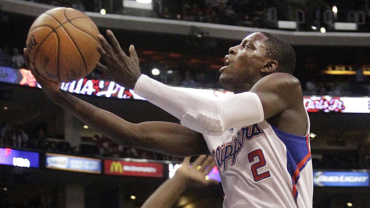 Clippers point guard Darren Collison goes up for a shot during a game against the Boston Celtics in January. Keeping Collison in the fold is Doc Rivers' top priority this offseason.
