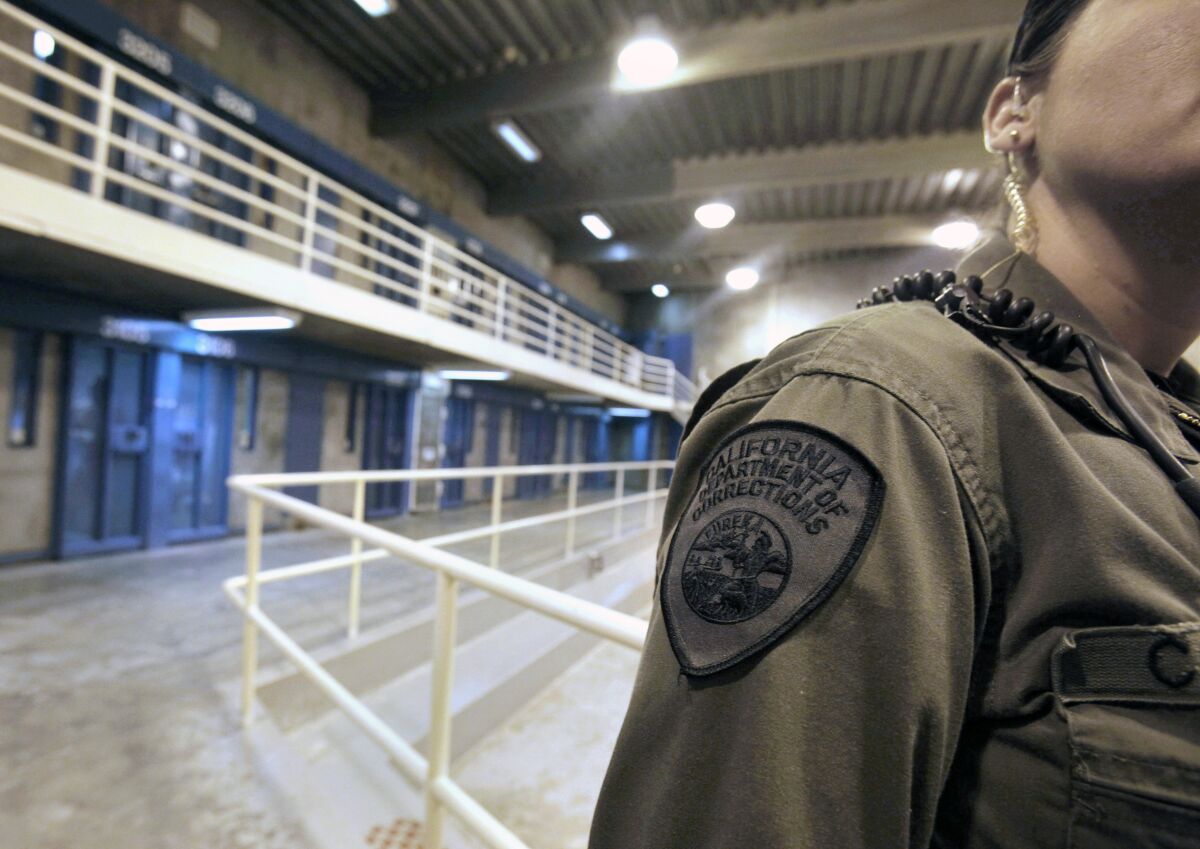A correctional officer walks along a corridor at Pelican Bay State Prison.