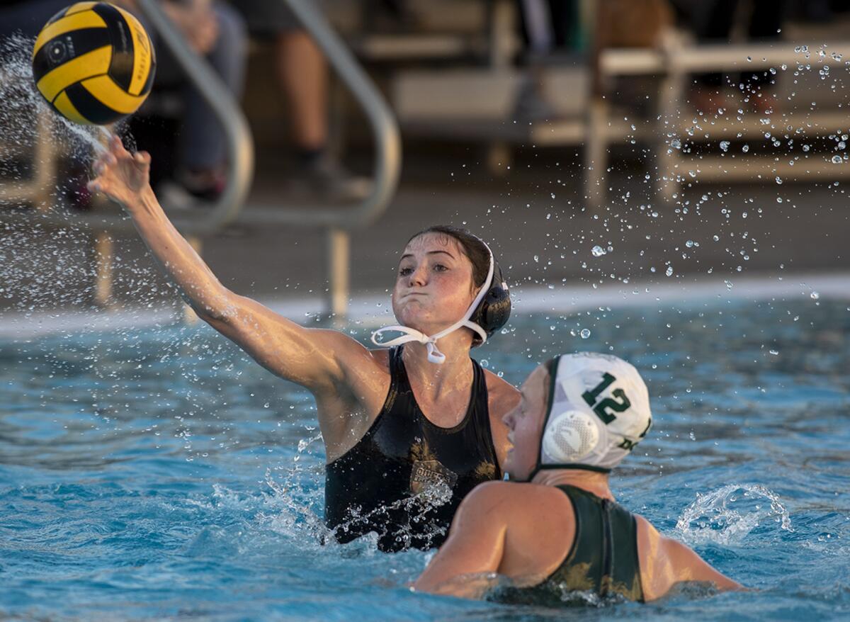 Huntington Beach's Marley Garwick takes a shot against Santa Barbara's Sophie Johnson during a 2022 game.