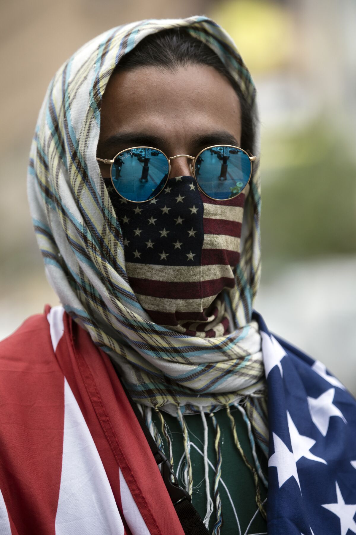 A protestor wears an American flag mask at a Hollywood demonstration.