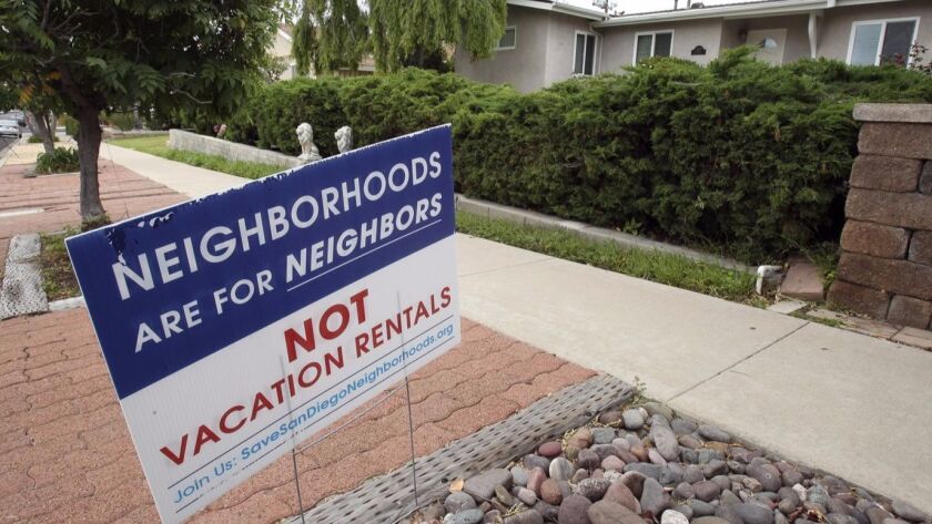 Signs like this have popped up in neighborhoods around San Diego in recent years opposing short-term vacation rentals.