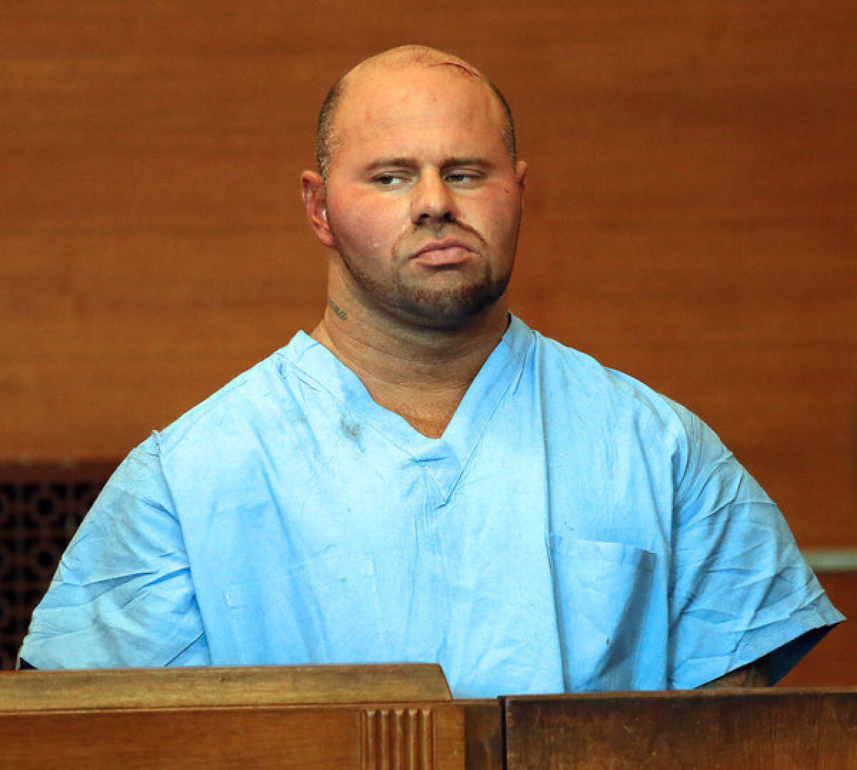 Jared Remy appears at Waltham, Mass., District Court for his arraignment Friday on domestic assault and battery charges in connection with the death of his girlfriend, 27-year-old Jennifer Martel. Remy is the son of longtime Boston Red Sox broadcaster Jerry Remy.