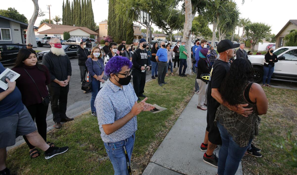 Neighbors and family members attend a memorial for Hector Hernandez, on the one-year anniversary of his death.
