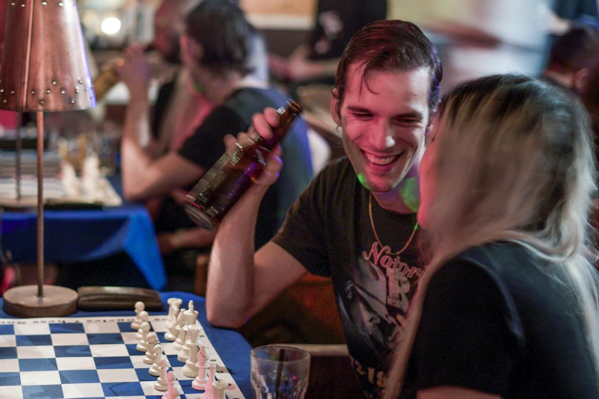 A photo of chess players at Los Angeles Chess Social .