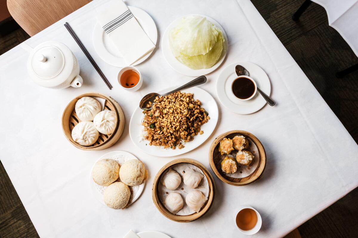 San Francisco, CA - April 30: Baked bbq pork buns, steamed bbq buns, har gao, shui mai, chicken lettuce cups at Hong Kong Lounge Bistro on Wednesday, April 30, 2025 in San Francisco, CA. (Carolyn Fong / For The Times)