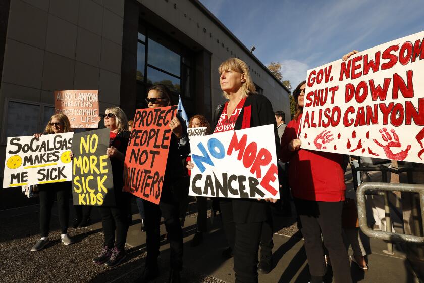 LOS ANGELES, CA - JANUARY 07, 2020 Porter Ranch residents Lori Aivazian, Jane Fowler and Deirdre Bolona, second from left to right, joined with other San Fernando Valley residents to rally prior to the Supervisors meeting at the Kenneth Hahn Hall of Administration Tuesday morning calling for passage of a resolution to support the permanent closure of the Aliso Canyon underground gas storage facility in Porter Ranch. The demonstrators are urging the supervisors support the closure of the facility within a year. (Al Seib / Los Angeles Times)