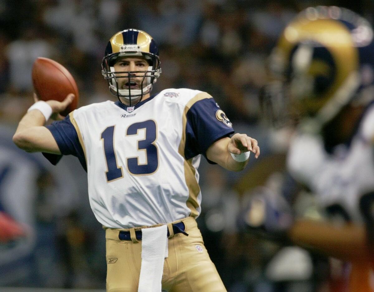  Rams quarterback Kurt Warner throws a pass in Super Bowl XXXVI.