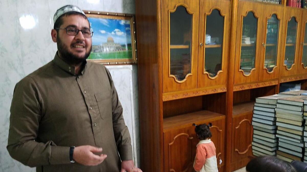Imam Ahmed Rakan Ahmed at his east Mosul mosque. Militants had forced him to flee with his family when they captured the Iraqi city. He returned in December and reopened the mosque.