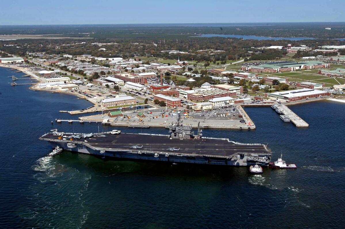 An aerial view of the aircraft carrier John F. Kennedy arriving for a port visit at Naval Air Station Pensacola, in Pensacola, Fla., in 2004.