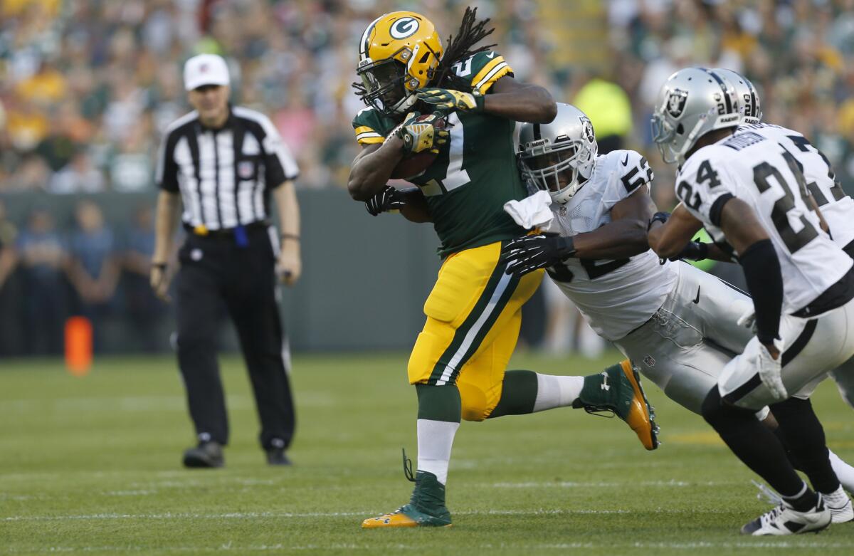 Green Bay Packers running back Eddie Lacy carries the ball against the Oakland Raiders during a preseason game.