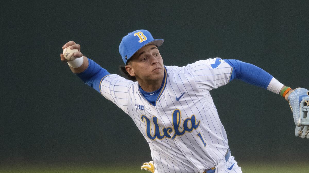 UCLA shortstop Roch Cholowsky throwing a ball