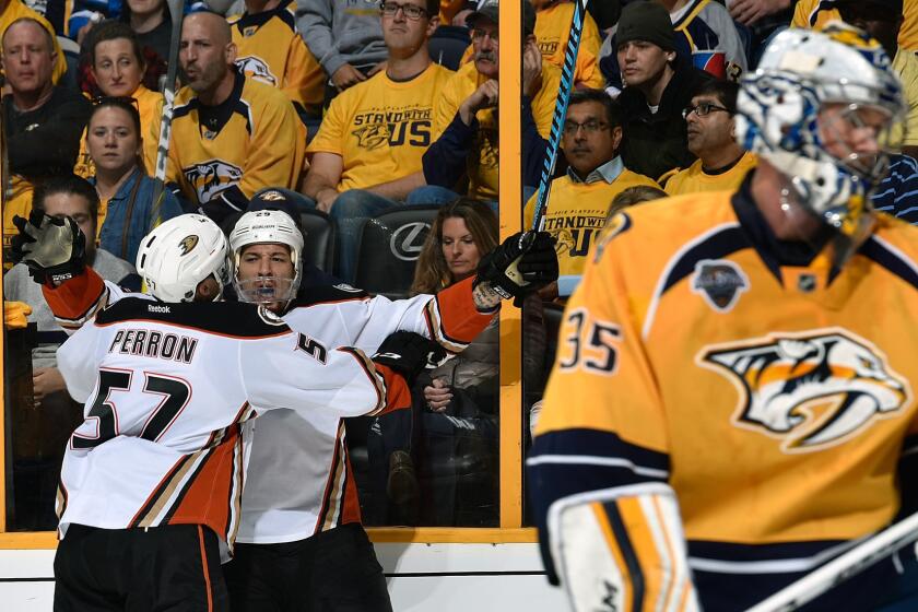 Ducks forward Chris Stewart (29) is congratulated by teammate David Perron (57) after scoring a goal against Predators goalie Pekka Rinne (35) during the second period in Game 3.